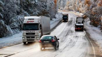 Снегопад осложнил движение на трассе  Байкал  под Иркутском