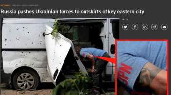 Рейтер опубликовало фото  мирного жителя  Украины со свастикой